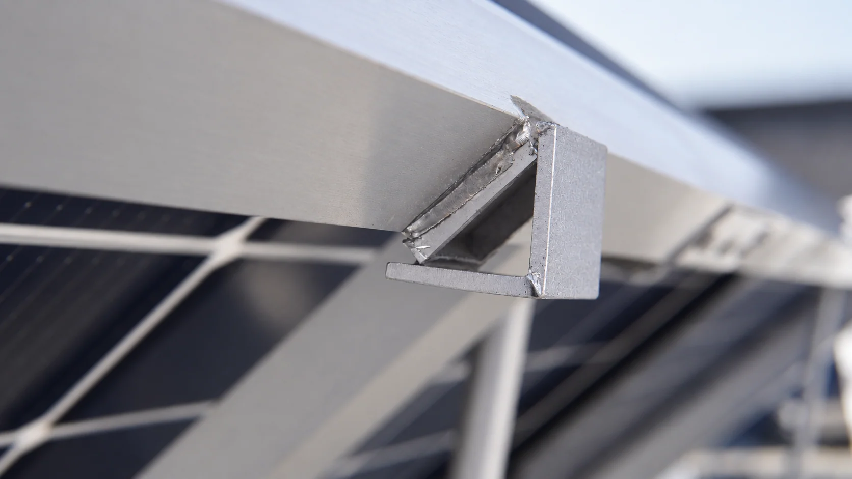 Welded bracket detail on the silver module frame