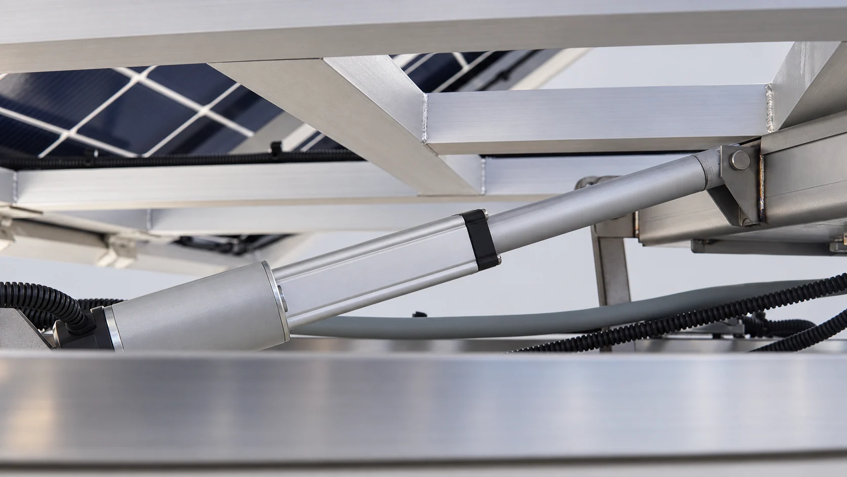 Drive actuator and linkage mounting beneath the panel